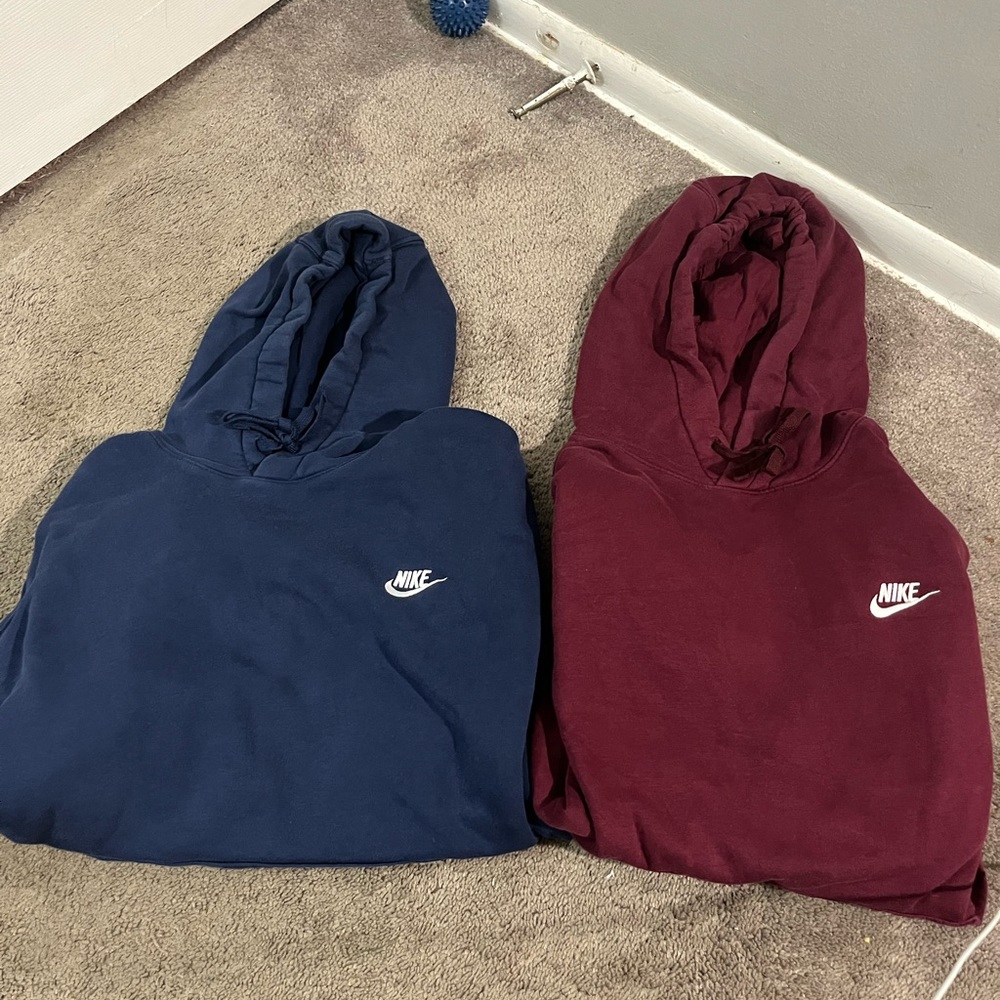 Two classic Nike hoodies. One navy and one maroon